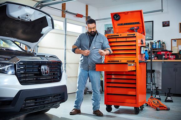 Homeowner with orange tool box